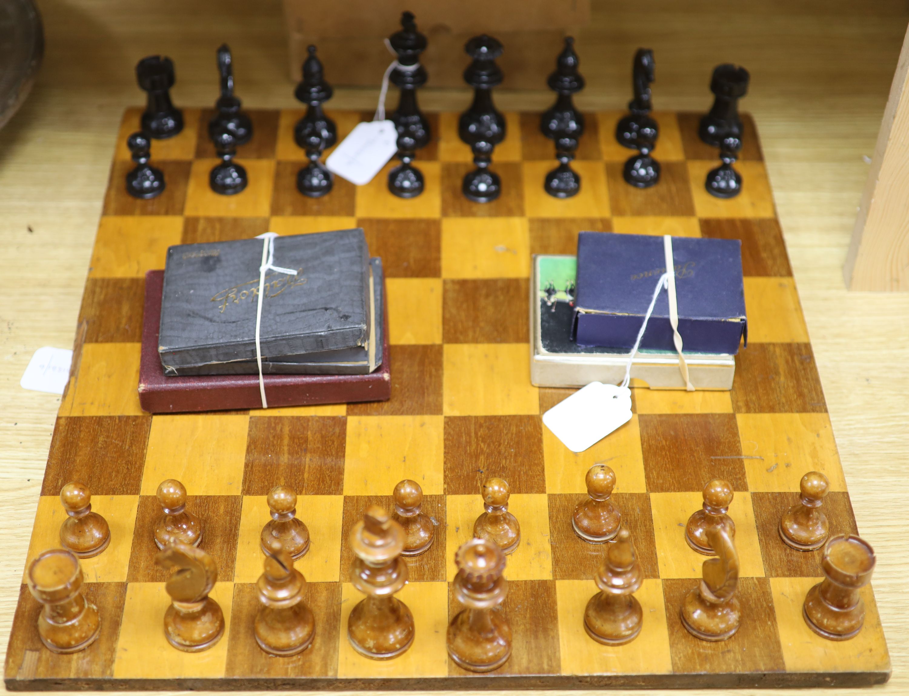 A Staunton style boxwood chess set, a chess board and miscellaneous card games